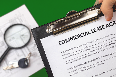 Commercial lease agreement on clipboard