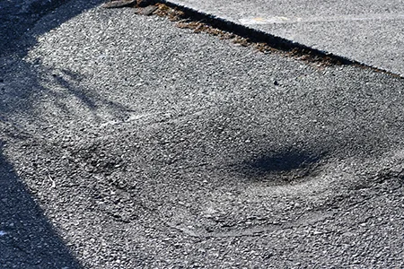 Warped asphalt from heat exposure